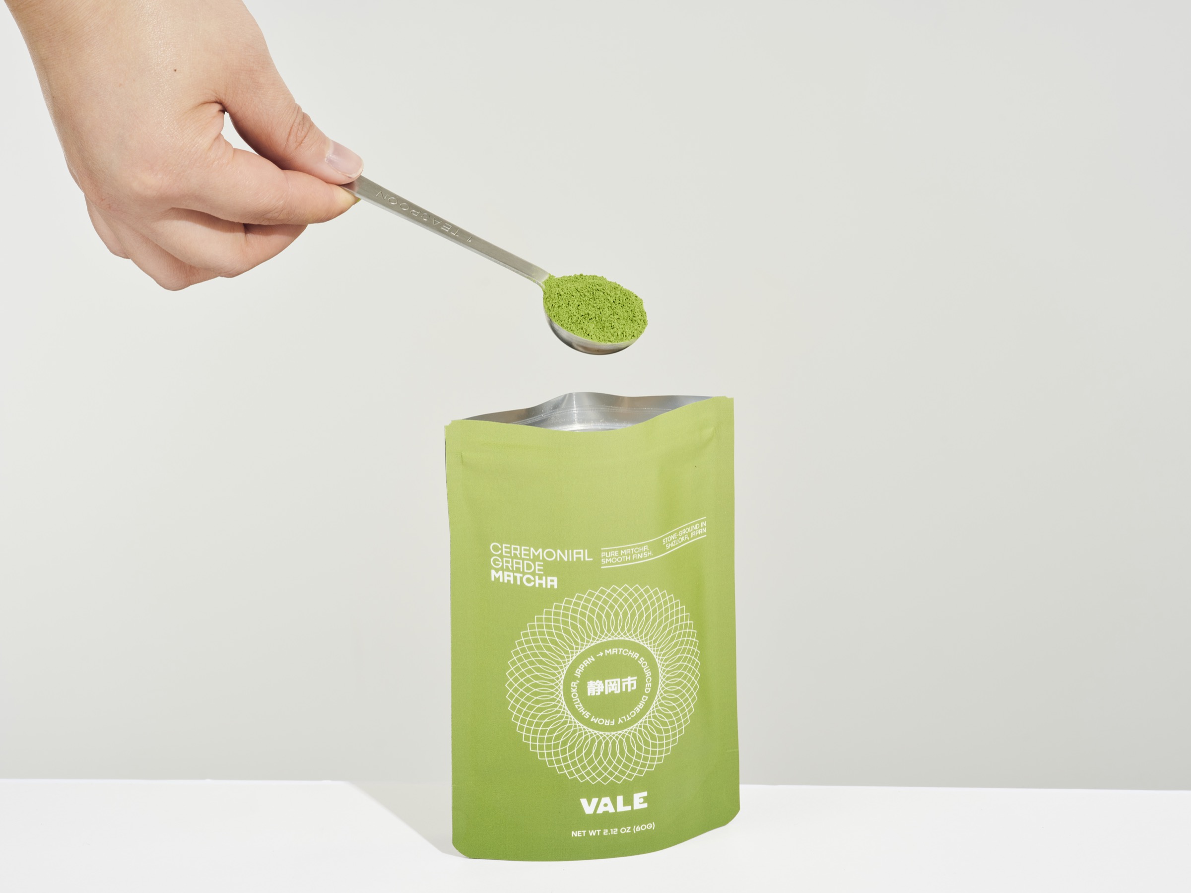 Vale ceremonial grade matcha bag with scoop of vibrant green powder